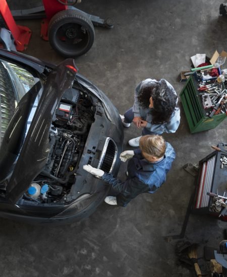 top-view-man-repairing-car